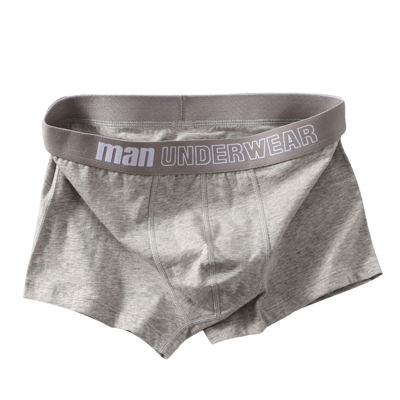 Solid gray men's cotton boxers with elastic waistband, providing comfort and style for everyday wear.